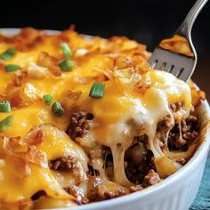 a close up of a casserole dish with meat and cheese