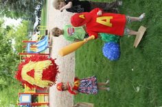 children are playing in the park with toys and paper mache hats on their heads