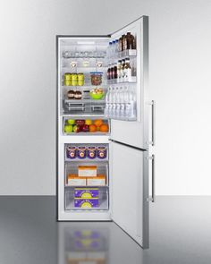 an open refrigerator filled with lots of food and drinks on top of a shiny surface