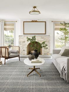 a living room filled with furniture and a fire place