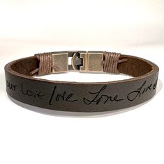 "A personal touch increases the value of any gift specially of these sentimental beautiful long lasting handwriting bracelets. Transform your loved one's handwriting into a beautiful keepsake, or your OWN! Personalized the outside, or on the inside of the bracelet with a signature, handwriting, or drawing in any language of your choice. The actual handwriting has been burned into the leather and will not fade away with wear., The inside engraving can not be seen by anyone but can be only seen by the wearer.. ### For this bracelet Can be engraved the outside OR inside with the Actual HANDWRITING and with regular font request on the opposite side of the band if you select (Out-In),  in the drop down menu. ### If you do not have handwriting, we can also use your selected font for the sample f Adjustable Signature Style Bracelet For Anniversary, Adjustable Laser Engraved Bracelets For Everyday Wear, Stamped Leather Bracelet As Gift, Meaningful Adjustable Bracelets With Engraved Text, Hand Stamped Brown Bracelets For Gifts, Hand Stamped Brown Bracelets As Gift, Handwriting Bracelets, Custom Signature, Personalized Leather Bracelet