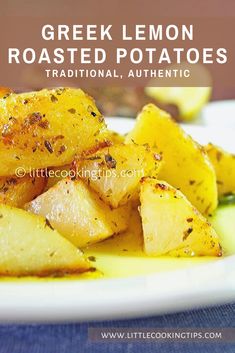 greek lemon roasted potatoes on a white plate