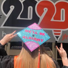 a woman wearing a graduation cap with the words, we are all right on it