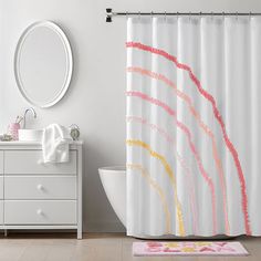 a bathroom with a sink, mirror and shower curtain that has colorful brush strokes on it