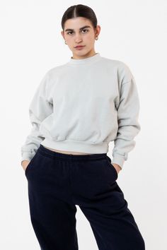 Made from a luxurious 14oz fleece, our cropped sweater is meticulously designed to flatter your curves and accentuate your waist. The cropped silhouette hits just above the belly button, highlighting your toned mid-section and creating a balanced look. The sleeves are slightly dropped and the neckline is higher for a relaxed yet modern look. Whether you're dressing up for a night out or dressing down for a casual day, our cropped sweater is the perfect addition to your wardrobe.This hoodie is Garment Dyed.Our garment-dyed crewneck sweaters are dyed after they're sewn, which gives them a more durable and even color, including in the stitching and ribbing. This also means they'll have less shrinkage and colors will stay true after repeated washings.Features: Made from our premium 14oz heavyw Lace Knitwear, Los Angeles Apparel, Workwear Jacket, Jumpsuit Jacket, Long Torso, Sleeveless Vest, Active Wear Leggings, Belly Button, Cropped Sweater