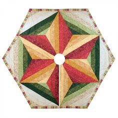 an image of a quilted table topper that looks like a starburst