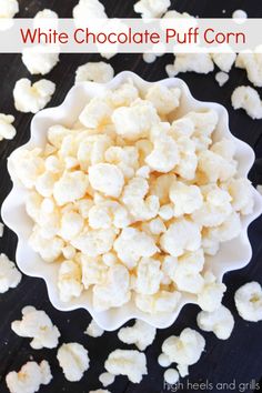 white chocolate puff corn in a bowl on top of a black surface with the words, how to make white chocolate puff corn