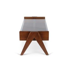 a small wooden table with glass top and legs on the bottom, against a white background