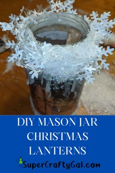 a mason jar filled with snowflakes and text that reads diy mason jar christmas lanterns