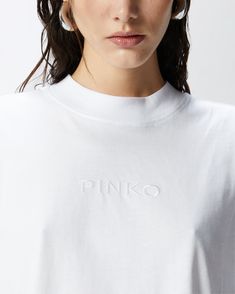 Very short-sleeved cropped T-shirt in cotton jersey with central front PINKO logo embroidery. Trendy Tops With Embroidered Logo, Summer Cropped Shirt With Logo Print, Cotton Cropped Shirt With Logo Print, Embroidered Logo Tops For Summer, Cotton Cropped T-shirt With Embroidered Logo, Casual Cropped T-shirt With Embroidered Logo, Casual Cropped Cotton T-shirt With Embroidered Logo, Summer Tops With Logo Detail, Spring Short Sleeve Tops With Logo Detail