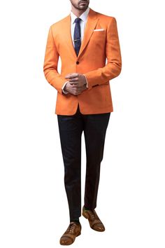 Orange blazer jacket with front flap pocket.
Components:1
Neckline:Peak lapel collar
Sleeve Length:Full
Fabric:Linen
Color:Orange
Welt pocket
Closure:Front button
Note: The neck tie, pocket square, shirt and pants worn by the model are not for sale. - Aza Fashions Formal Orange Outerwear With Notch Lapel, Formal Orange Notch Lapel Outerwear, Fitted Orange Outerwear With Notch Lapel, Semi-formal Sport Coat With Patch Pockets And Suit Collar, Tailored Long Sleeve Orange Outerwear, Semi-formal Sport Coat With Patch Pockets, Orange Long Sleeve Formal Blazer, Tailored Nehru Jacket With Notch Lapel, Semi-formal Nehru Jacket With Notch Lapel