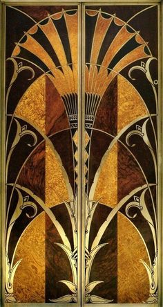 an art deco door with gold and brown designs