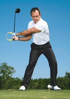 a man swinging a golf club at a ball