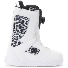 a white snowboard boot with black and white leopard print on the bottom, side view