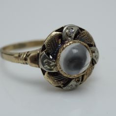 Art Nouveau Moonstone Ring 14k Gold size 6.75  The Ring Face is 12mm across by 6.8 mm in height   The ring is a size 6.75 this ring can be sized at a lost It comes with a new ring box. Item # 5824 Vintage 14k Gold Moonstone Ring For Anniversary, Antique White Rings With Halo Setting, Art Deco Cabochon Ring For Anniversary, White Rings With Center Stone For Collectors, White Collectible Rings With Center Stone, Vintage Round Cabochon Rings, Victorian White 14k Gold Rings, Heirloom Moonstone Ring, Vintage White Rings With Halo Setting