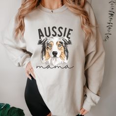 Australian Shepherd Mom Sweatshirt, Aussie Shepherd Mama Crewneck Gift, Blue Merle Aussie Dog Mom Jumper, Australian Shepherd Gifts  * 50% cotton, 50% polyester * Pre-shrunk * Classic fit * 1x1 athletic rib knit collar with spandex * Air-jet spun yarn with a soft feel and reduced pilling * Double-needle stitched collar, shoulders, armholes, cuffs, and hem This product is made especially for you as soon as you place an order, which is why it takes us a bit longer to deliver it to you. SIZING: Alt Long Sleeve Cotton T-shirt With Dog Print, Cotton Long Sleeve T-shirt With Dog Print, Blue Merle Aussie, Aussie Dog, Mama Crewneck, Aussie Shepherd, Aussie Dogs, Womens Hoodies, Blue Merle