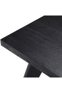 a black wooden table with metal legs