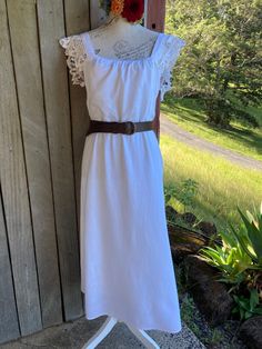 "white dress linen / viscose blend featuring cotton lace on the shoulders and upper back with long slender ties at the low back lined ** note that this is a modified quality preloved garment  SIZE   ~  small / medium  armpit to armpits across the front is 53 cm / 21\"  92 cm / 36\" around the high waist ( the seam below the bust) length is  119 cm / 47\" mannequin is size small the leather belt isn't included in the sale, but the matching white sash is." Bohemian White Midi Dress With Lace Trim, Bohemian Midi Dress With Lace Trim For Brunch, White Midi Dress With Lace Sleeves For Summer, Fitted White Linen Bohemian Dress, Fitted White Linen Dress Bohemian Style, Fitted White Bohemian Linen Dress, White Fitted Bohemian Linen Dress, White Sash, Dress Linen