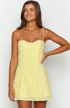 Yellow Sequin Mini Dress  How to style: This gorgeous yellow sequin () dress is perfect for drinks with the girls or your next night out! Shimmer and shine, pair with dainty gold jewellery  ()and strappy heels  ()and you will be ready to dance the night away!  Features:     * Light weight material   * Sequin   * Adjustable spaghetti straps   * Sweetheart neckline   * Mini length   * Invisible zip   * Lined Long Sleeve Flowy Mini Dress, Neon Yellow Homecoming Dresses, Homecoming Dress Freshman, Light Yellow Homecoming Dresses, Mini Yellow Dress, Loose Hoco Dresses, Hoco Dress Inspo 2024, Light Yellow Hoco Dress, Yellow Hoco Dress Short