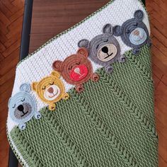 there is a crocheted blanket with teddy bears on the front and back sides