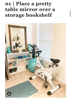 a white exercise bike sitting in front of a mirror next to a blue ball and yoga mat