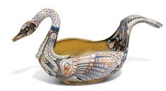 an artistically designed ceramic swan bowl on a white background with clippings to the side