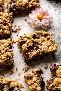 chocolate and oatmeal cookie bars on a baking sheet with a pink flower