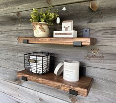 two wooden shelves holding candles and other items