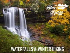 a waterfall surrounded by trees in the fall