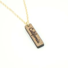 This dainty personalized vertical bar necklace is the perfect unique gift for any occasion. Made with 100% 1/8" thick wood with a gold chain necklace. Personalize this with your custom name or wording. Each necklace is individually designed, assembled, and made to order. The wooden bar is approximately 6mm x 23mm (1/4in x 1in) depending on the length of the name. Chain length is 16" . Please contact us if you need a custom length for the chain. Great for birthdays, as bridesmaids gifts, mother's Black Acrylic Earrings, Vertical Bar Necklace, Vertical Bar, Feminist Gift, Unique Gifts For Women, Acrylic Jewellery, Necklace Unique, Wooden Bar, Unique Gifts For Her