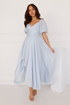 Length from shoulder to hem of size S: 131cm. Chest: 35cm, Waist: 31cm, across front only of size S. Midi dress. Lined. Model is a standard XS and is wearing size XS. True to size. Non-stretch. V-neck. Elastic puff sleeves. Textured fabrication. Flowy skirt. Split to skirt. Elastic back. Zipper. Cold hand wash only. Tencel/Nylon/Rayon. The dreamiest dress is here, lovely! For lovers of effortless style, be seen in the Gentle Breeze Midi Dress. Featuring a V-neck, elastic puff sleeves and a flowy skirt. Dress it up with heels or keep it simple with sandals. Uc Davis, Dress Date Night, Midi Dress Blue, Prom Shopping, Grad Photos, Dreamy Dress, Flowy Skirt, Blue Midi Dress, For Lovers