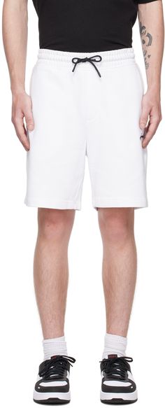 French terry shorts. · Drawstring at elasticized waistband · Three-pocket styling · Mock-fly · Logo embroidered at front Supplier color: White White Casual Athletic Shorts With Side Pockets, Casual White Athletic Shorts With Side Pockets, White Cotton Athletic Shorts With Drawstring, Fly Logo, Outfit Uomo, French Terry Shorts, Terry Shorts, Embroidered Shorts, Logo Embroidered