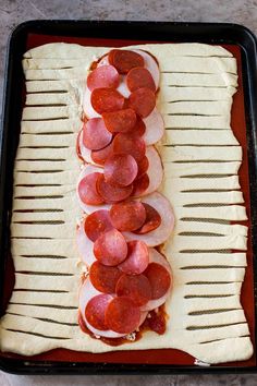 the pizza is prepared and ready to be cooked in the oven or put into the pan