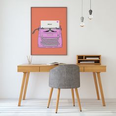 a desk with a chair and an old fashioned typewriter on the wall above it