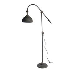 an old fashioned metal floor lamp on a white background