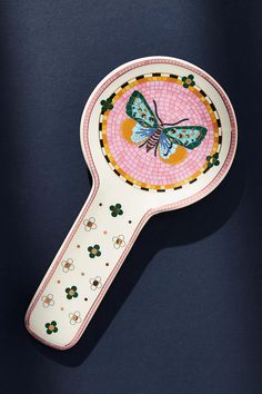 a mirror with a butterfly painted on it