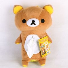 a brown teddy bear wearing a diaper and holding a tissue in it's hand