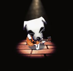 a cartoon dog with a guitar in its mouth on a brick floor at night time