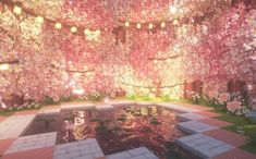 a room filled with lots of pink and white flowers next to a pool of water