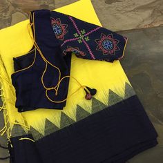 This yellow/navy blue linen temple border saree has been woven using a technique of three shuttle weaving and a interlocking weft.… Temple Border Saree, Blue Work Blouse, Ikat Blouse, Kutch Work, Linen Sarees, Border Saree