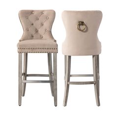 two chairs with buttons on the back and one has a ring at the end of it