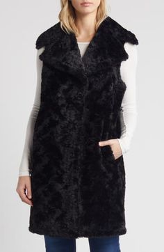 Layer up for colder weather without compromising on style in a plush faux-fur vest cut in a longline silhouette framed by luxuriously oversized notched lapels. 37" length (size Medium) Front button closure Notched lapels Front welt pockets Unlined 100% polyester faux fur Dry clean Imported Black Faux Fur Coat For Workwear, Black Faux Fur Coat For Work, Sleeveless Fur Coat With Faux Fur Lining For Fall, Sleeveless Outerwear With Faux Fur Lining For Fall, Sleeveless Fall Outerwear With Faux Fur Lining, Sleeveless Faux Fur Coat For Fall, Sleeveless Outerwear With Faux Fur Trim For Fall, Fall Sleeveless Outerwear With Faux Fur Trim, Sleeveless Faux Fur Outerwear