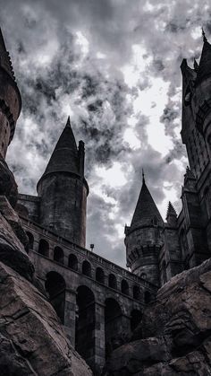 an image of a castle that looks like it is in the middle of some rocks