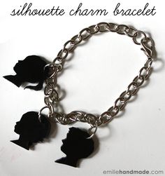 the silhouette charm bracelet is made with black paper and has three small cut outs on it