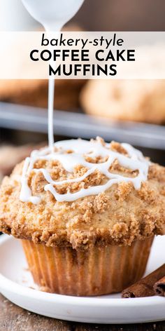 a cupcake with white icing sitting on top of a plate