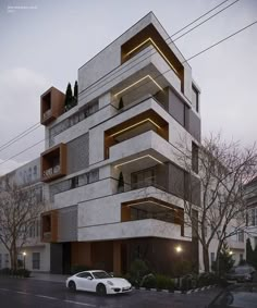 a white car parked in front of a tall building with balconies on it