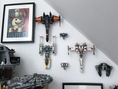 star wars legos are arranged on the wall above a desk in a playroom