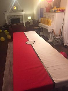 a large red and white bed in a living room