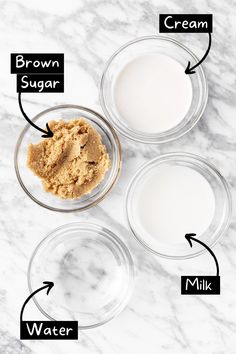 three bowls filled with different ingredients on top of a marble countertop next to milk and sugar