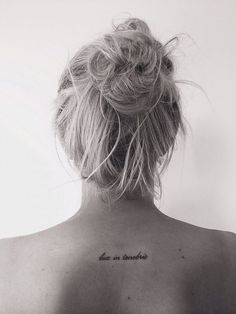 a woman with a tattoo on her back